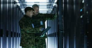 Soldiers working in a server room for managed IT