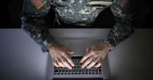 Solider working on a laptop