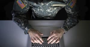 Soldier working on laptop