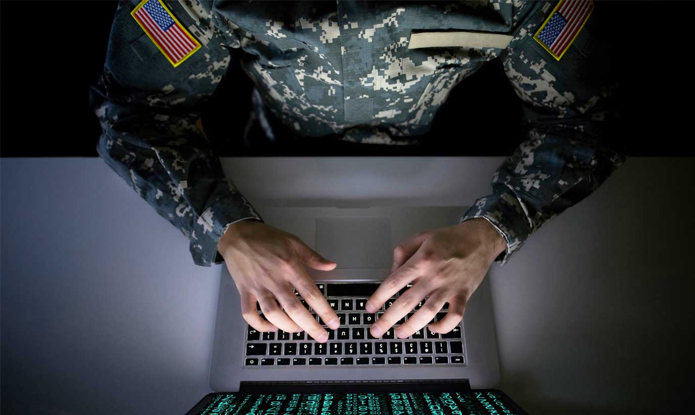 DoD contract worker works on a laptop connected to Microsoft Government Community Cloud (GCC)